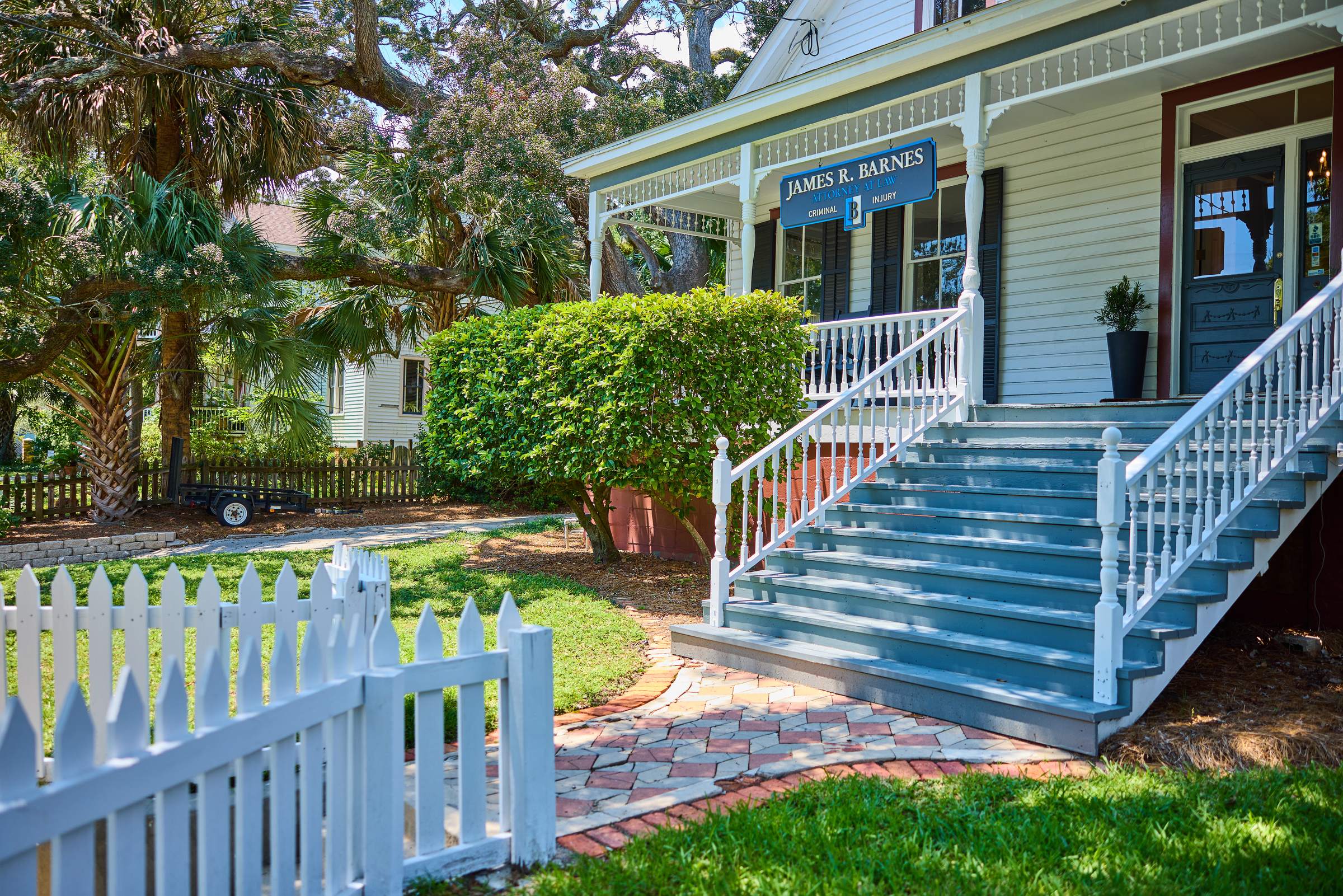 The James R. Barnes office porch, sign, and staircase at 816 E. La Rua Street in Pensacola