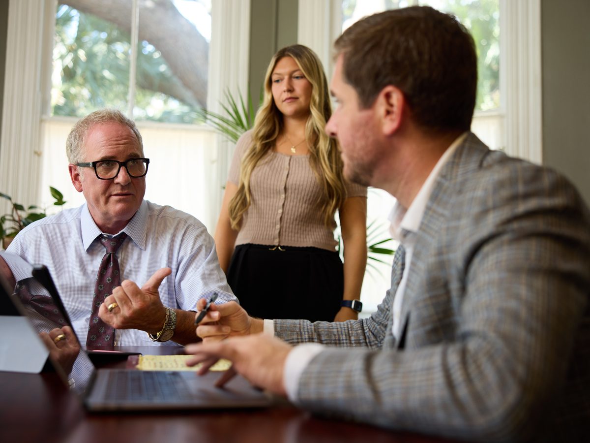 The Barnes Law legal team working together at the conference table